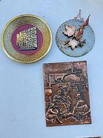 All three metal art pieces grouped