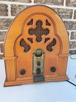 Front view of Thomas Collector’s Edition radio showing wood cabinet and controls