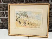 Full view of framed watercolour displaying bridge scene