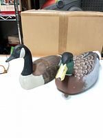 Front view of both wooden ducks