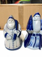 Front view of both Eldridge Pottery Santa figurines