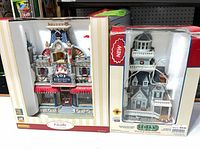 Both boxed Lemax buildings side by side