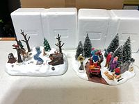 Both Lemax scenes side by side with styrofoam boxes