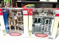 Both boxed Lemax buildings side by side