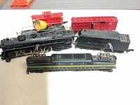 Group view of both locomotives, tender, caboose and boxcar