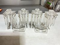 Both glass candle holders front view showing overall design and prisms