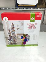 Front of sealed retail box showing product image, brand, sizes and price sticker