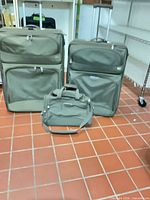 Front view of three matching khaki Dakota luggage pieces
