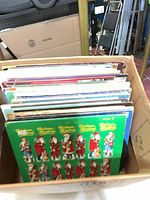 Box of approx. 50 LP records with various sleeve designs visible