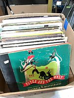 Box with stack of vinyl LPs, Peter and the Wolf at front