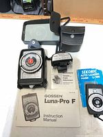 All three meters, cases and manuals displayed