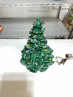 Full view of ceramic Christmas tree assembled with lights