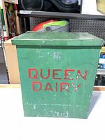front view showing QUEEN DAIRY lettering and overall paint wear
