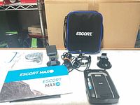 All lot contents: detector, case, mounts, cables, manual