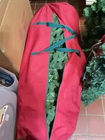 Artificial tree inside red bag, top view