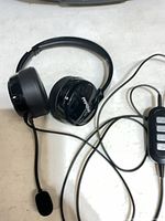 Full view of Mpow over-ear headset showing boom mic and cable