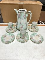 Full lot view: pitcher, 3 cups, 5 saucers