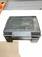 Closed black carry case showing Craftsman branding