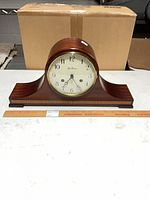 Front view of Seth Thomas tambour mantel clock on table