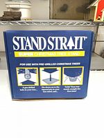 Front of retail box showing Stand Strait branding and usage illustrations