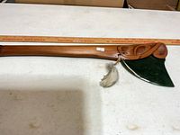 Full view of axe with ruler confirming length