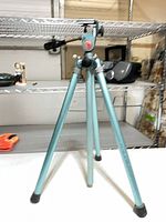 Full view of light blue Welt tripod standing on table