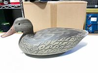 left profile of duck decoy showing paint detail