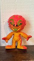 Front view of multicolour rubber monster figure showing details and colours