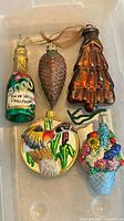 Front view of all five ornaments in tray