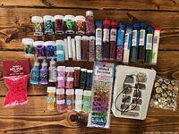 Overall view showing all containers of glitter, sequins, rhinestones, pom poms and studs