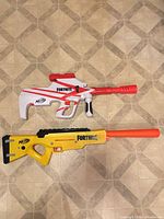Top view of both Fortnite blasters showing overall forms and colours