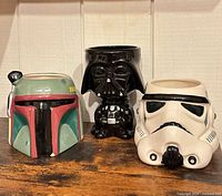 Front view of three Star Wars helmet mugs