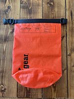 Front view showing Unigear logo, roll-top strap and buckle