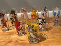 Group of nine glasses showing all characters