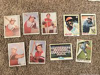 All nine cards displayed on carpet