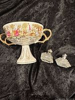Loft compote with gold handles and two Irice shakers on black backdrop