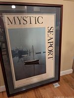 Front view showing Mystic Seaport poster, mat and frame