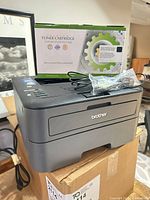 Printer with toner cartridge box and cables