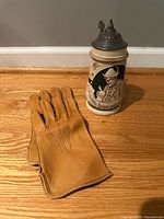 Gloves and stein full view