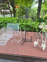 All display stands and easels arranged on surface outdoors