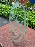 Full view of round glass topper showing etched pattern