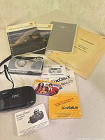 Full lot showing two cameras and assorted Kodak literature