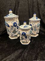 Front view of all three canisters with lids on