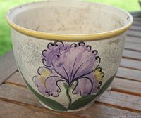 Planter front showing painted flower design
