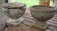 White and green glazed footed planters on wooden table
