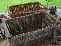 Top view of grey basket in front, brown behind on table