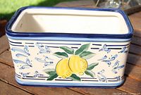 Side view showing lemon motif and blue decorative design