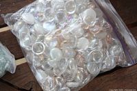Bag with clear iridescent flat glass gems