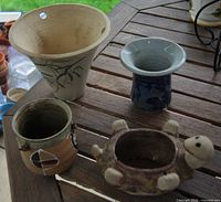 all four planters upright on table showing forms and colours