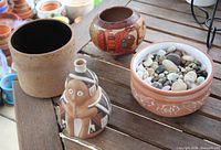 All four ceramic items displayed on table